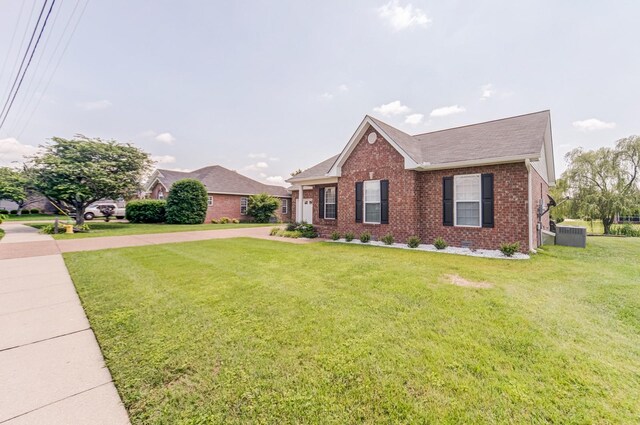 177 Hedgeway Ct, Gallatin, TN 37066 - ranch-style home featuring brick siding, a front yard, roof with shingles, and central AC