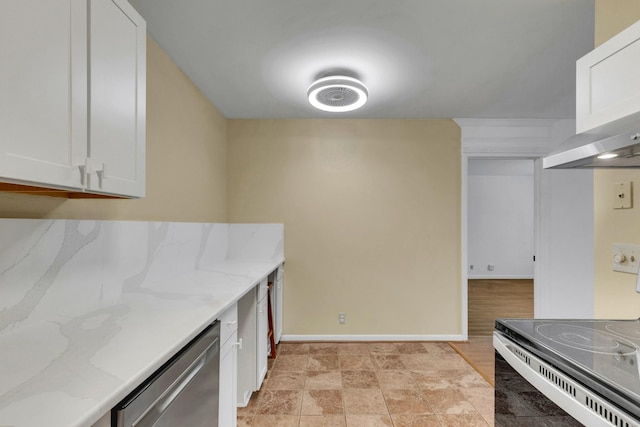 2601 Hillsboro Pike Unit E6, Nashville, TN 37212 - kitchen with electric range, stainless steel dishwasher, white cabinets, light stone counters, and baseboards