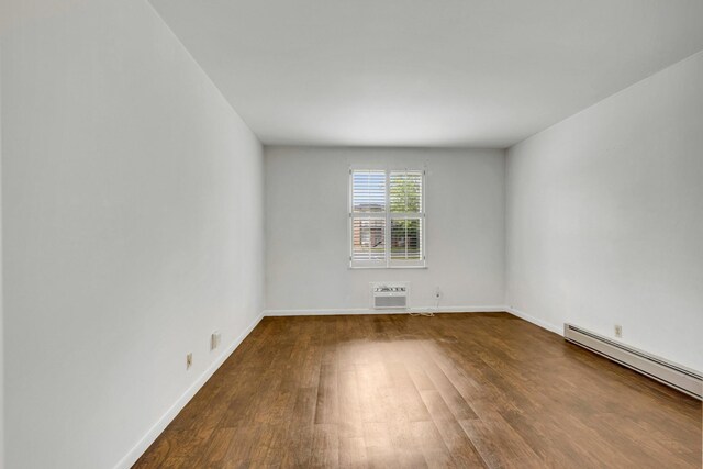 2601 Hillsboro Pike Unit E6, Nashville, TN 37212 - empty room with baseboard heating, wood finished floors, and baseboards