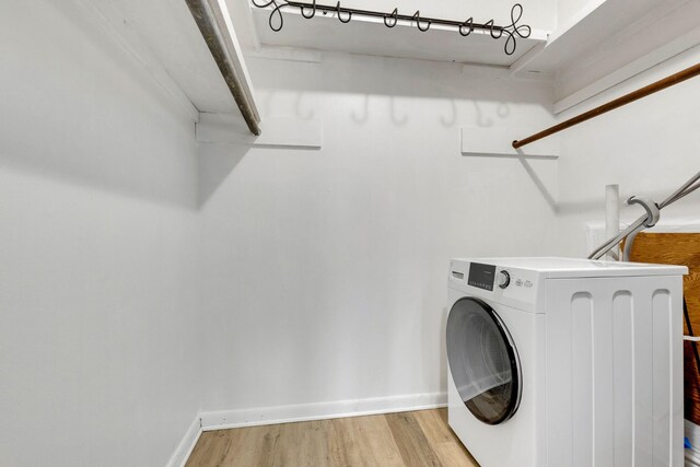 2601 Hillsboro Pike Unit E6, Nashville, TN 37212 - laundry area with washer / clothes dryer, light wood-style floors, and baseboards