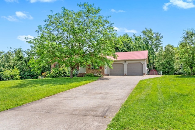 332 Meadowbrook Dr, Cadiz, KY 42211 - view of front facade featuring an attached garage, a front lawn, driveway, and metal roof