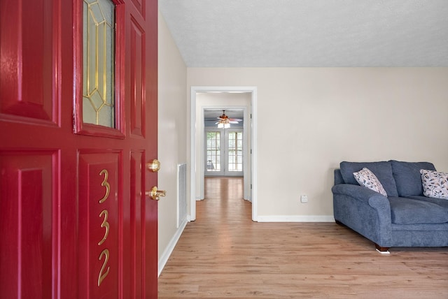 332 Meadowbrook Dr, Cadiz, KY 42211 - foyer with light wood-style floors, baseboards, a textured ceiling, and a ceiling fan