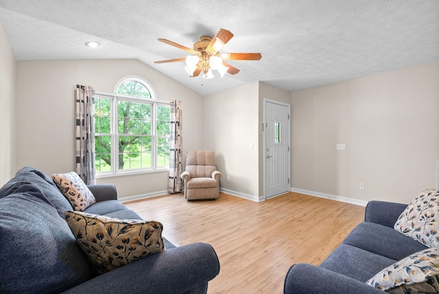 332 Meadowbrook Dr, Cadiz, KY 42211 - living area with light wood-type flooring, ceiling fan, lofted ceiling, baseboards, and a textured ceiling