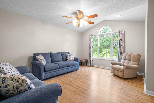 332 Meadowbrook Dr, Cadiz, KY 42211 - living area with vaulted ceiling, ceiling fan, light wood-style floors, baseboards, and a textured ceiling