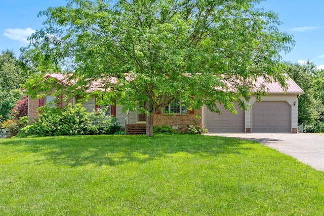332 Meadowbrook Dr, Cadiz, KY 42211 - obstructed view of property with an attached garage, asphalt driveway, a front lawn, and brick siding