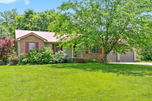 332 Meadowbrook Dr, Cadiz, KY 42211 - view of front of home featuring brick siding, a front yard, driveway, and metal roof
