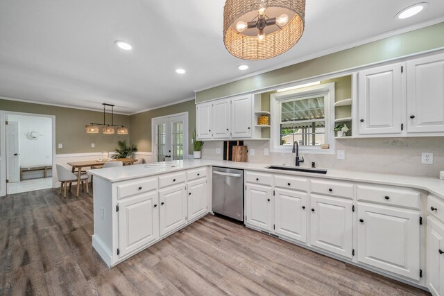 2250 Hamburg Rd, Michie, TN 38357 - kitchen with stainless steel dishwasher, a chandelier, open shelves, a sink, and ornamental molding
