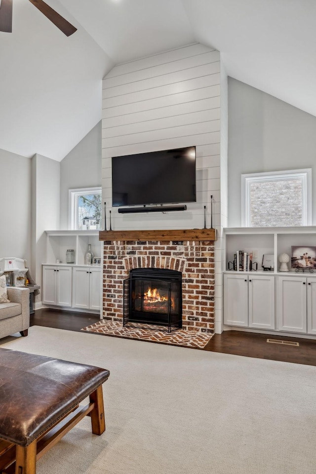 807 Caledonian Ct, Franklin, TN 37064 - living area with vaulted ceiling, a ceiling fan, and a brick fireplace