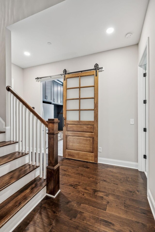 807 Caledonian Ct, Franklin, TN 37064 - foyer entrance with a barn door, wood finished floors, recessed lighting, stairs, and baseboards