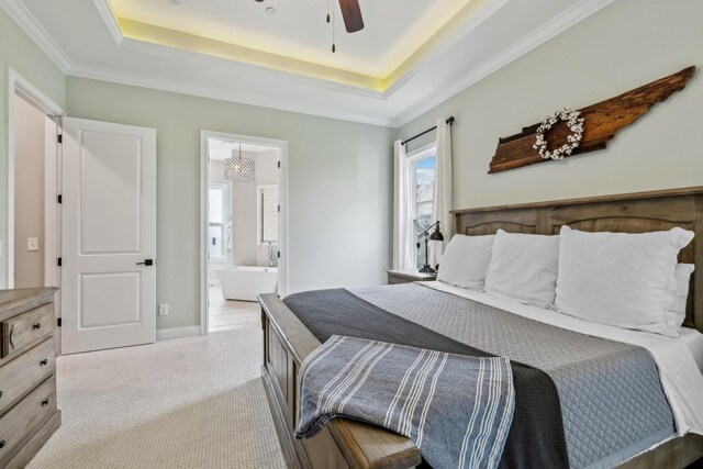 807 Caledonian Ct, Franklin, TN 37064 - carpeted bedroom featuring multiple windows, a tray ceiling, connected bathroom, and crown molding