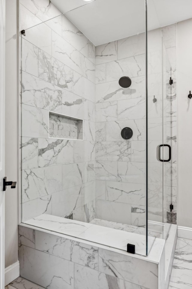 807 Caledonian Ct, Franklin, TN 37064 - full bath with marble look tile flooring, a shower stall, and baseboards