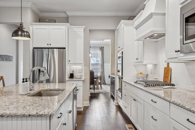 807 Caledonian Ct, Franklin, TN 37064 - kitchen featuring stainless steel appliances, premium range hood, a sink, white cabinetry, and dark wood-style flooring