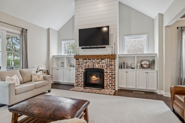 807 Caledonian Ct, Franklin, TN 37064 - living room with healthy amount of natural light, dark wood-style floors, a fireplace, and high vaulted ceiling