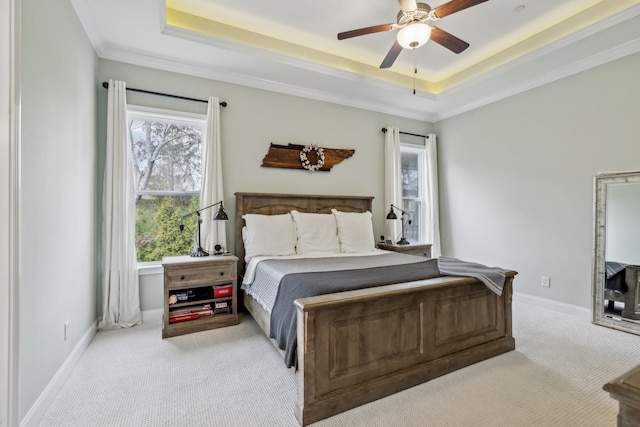 807 Caledonian Ct, Franklin, TN 37064 - carpeted bedroom featuring a tray ceiling, crown molding, baseboards, and ceiling fan