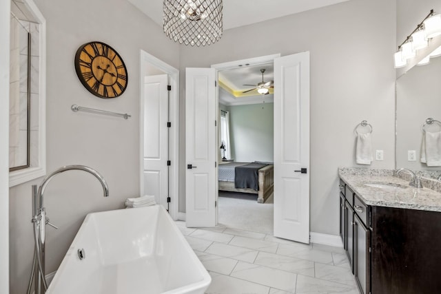 807 Caledonian Ct, Franklin, TN 37064 - ensuite bathroom featuring vanity, a soaking tub, marble finish floors, a ceiling fan, and baseboards
