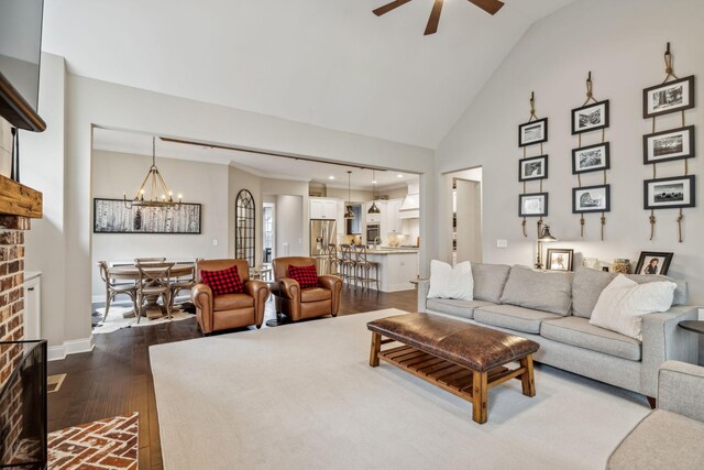 807 Caledonian Ct, Franklin, TN 37064 - living area with a chandelier, a ceiling fan, dark wood-style flooring, lofted ceiling, and baseboards