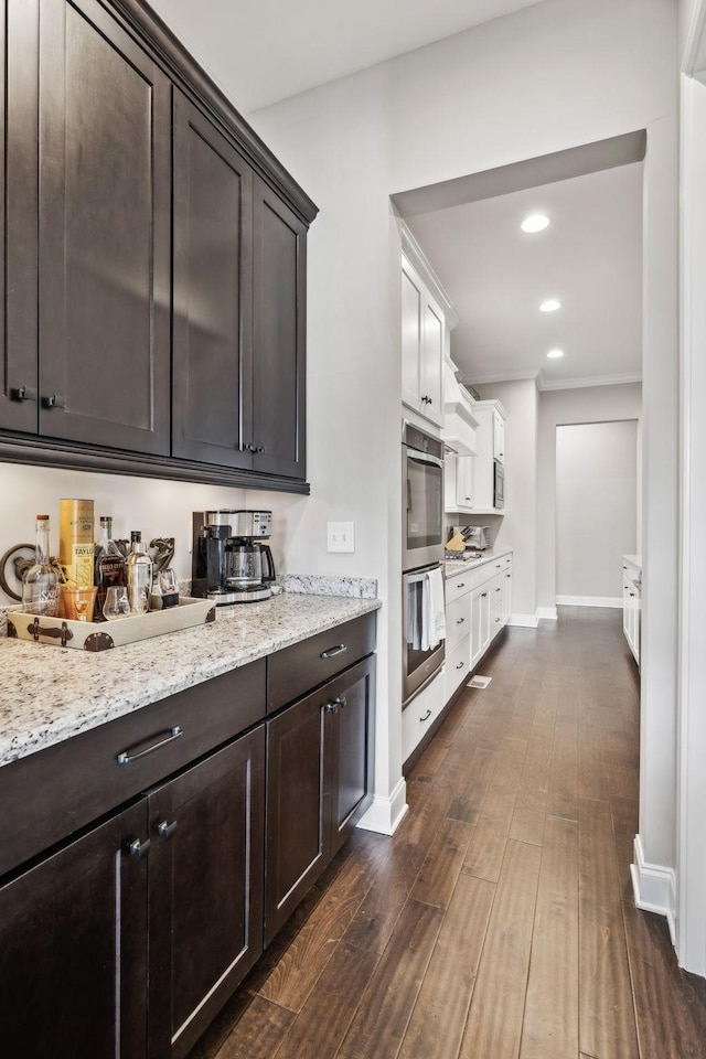 807 Caledonian Ct, Franklin, TN 37064 - kitchen featuring dark brown cabinetry, appliances with stainless steel finishes, crown molding, baseboards, and recessed lighting