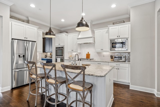 807 Caledonian Ct, Franklin, TN 37064 - kitchen featuring stainless steel appliances, a sink, premium range hood, dark wood-style flooring, and a center island with sink