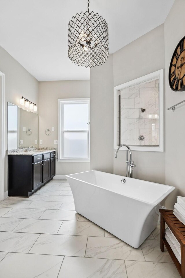 807 Caledonian Ct, Franklin, TN 37064 - full bathroom with vanity, marble finish floors, and a freestanding tub