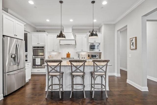 807 Caledonian Ct, Franklin, TN 37064 - kitchen with stainless steel appliances, white cabinetry, a center island, custom exhaust hood, and ornamental molding