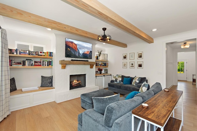 2019 Farm St, Mount Juliet, TN 37122 - living room featuring wood finished floors, beam ceiling, and a brick fireplace