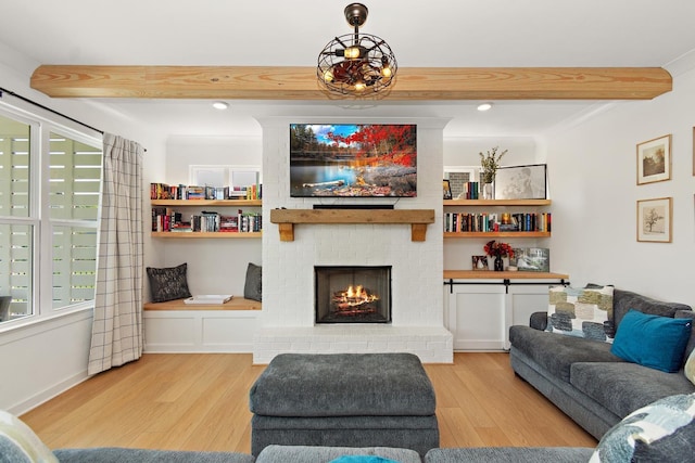 2019 Farm St, Mount Juliet, TN 37122 - living area with wood finished floors, beamed ceiling, and a brick fireplace
