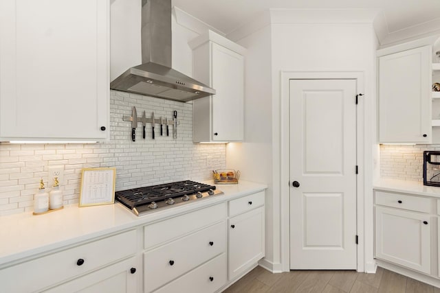 2019 Farm St, Mount Juliet, TN 37122 - kitchen with wall chimney range hood, stainless steel gas cooktop, decorative backsplash, open shelves, and white cabinets