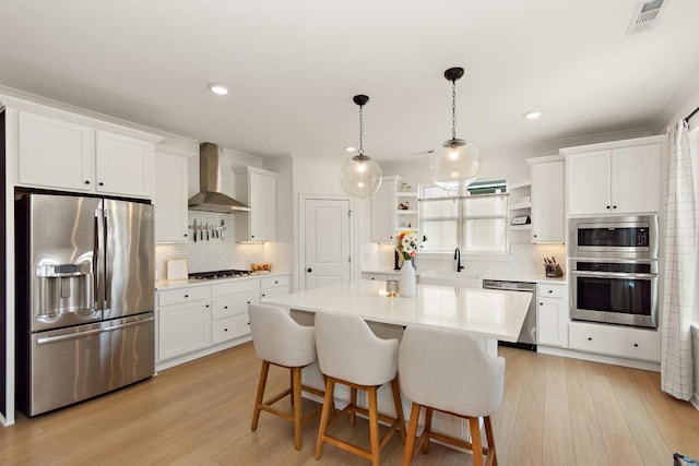 2019 Farm St, Mount Juliet, TN 37122 - kitchen with appliances with stainless steel finishes, wall chimney exhaust hood, open shelves, tasteful backsplash, and white cabinets