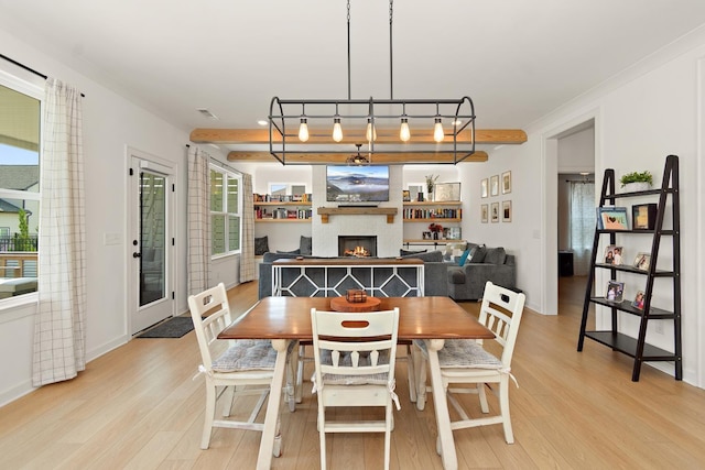 2019 Farm St, Mount Juliet, TN 37122 - dining area with light wood finished floors and a large fireplace