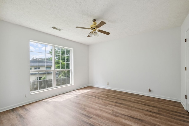 1068 Tulip Grove Rd, Hermitage, TN 37076 - empty room featuring wood finished floors, ceiling fan, a textured ceiling, and baseboards