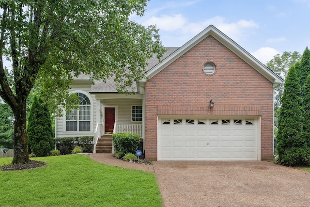 1068 Tulip Grove Rd, Hermitage, TN 37076 - view of front of house with brick siding, concrete driveway, a front yard, a shingled roof, and covered porch