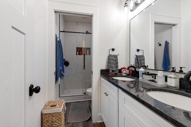 5660 Bold Springs Rd, Mc Ewen, TN 37101 - full bathroom with double vanity, a stall shower, and toilet