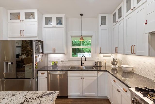 5660 Bold Springs Rd, Mc Ewen, TN 37101 - kitchen with stainless steel appliances, a sink, backsplash, and white cabinetry