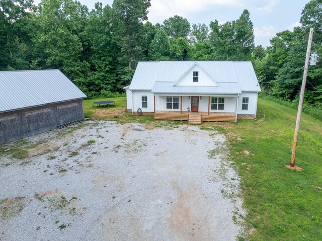 5660 Bold Springs Rd, Mc Ewen, TN 37101 - view of front of property with a porch, metal roof, and a front yard