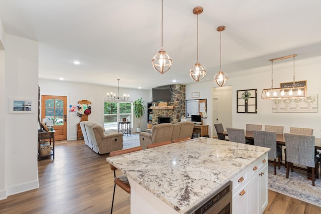 5660 Bold Springs Rd, Mc Ewen, TN 37101 - kitchen featuring dark wood-type flooring, a fireplace, white cabinetry, light stone countertops, and recessed lighting
