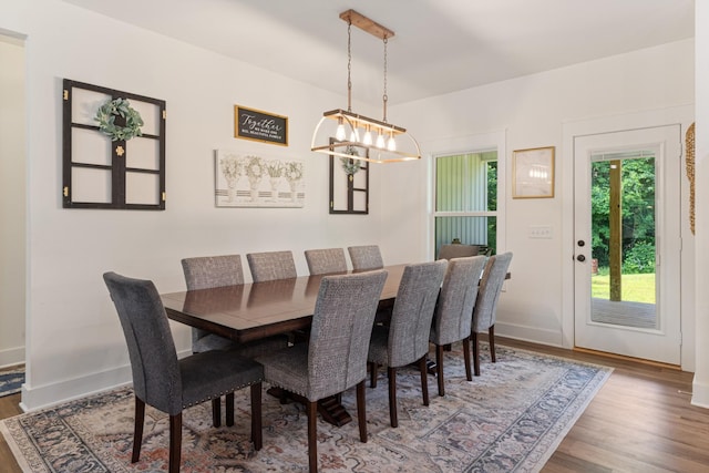 5660 Bold Springs Rd, Mc Ewen, TN 37101 - dining room with a chandelier, wood finished floors, and baseboards