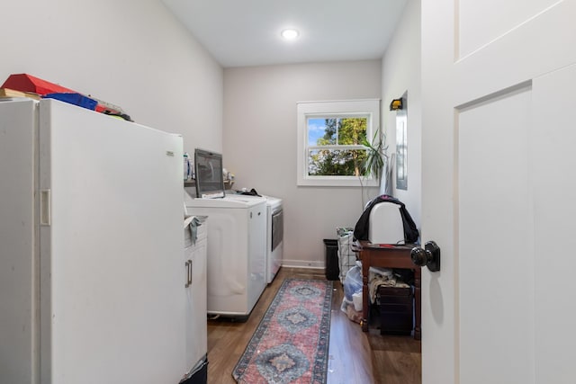 5660 Bold Springs Rd, Mc Ewen, TN 37101 - washroom featuring washer and dryer, cabinet space, and wood finished floors