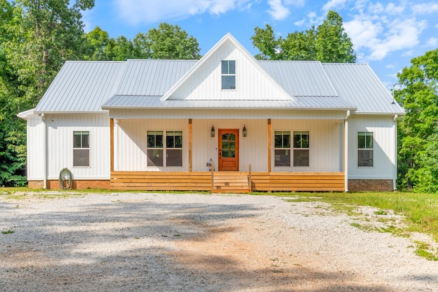 5660 Bold Springs Rd, Mc Ewen, TN 37101 - modern farmhouse style home with a porch and metal roof