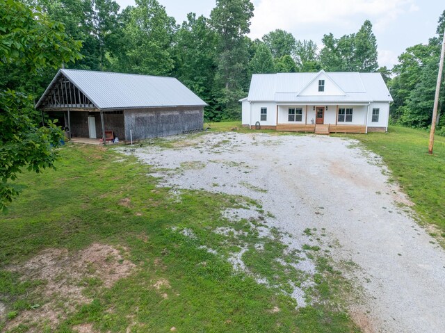 5660 Bold Springs Rd, Mc Ewen, TN 37101 - view of front of property featuring metal roof, driveway, and a front yard