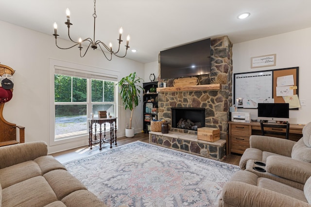 5660 Bold Springs Rd, Mc Ewen, TN 37101 - living area with wood finished floors, a chandelier, a stone fireplace, recessed lighting, and baseboards
