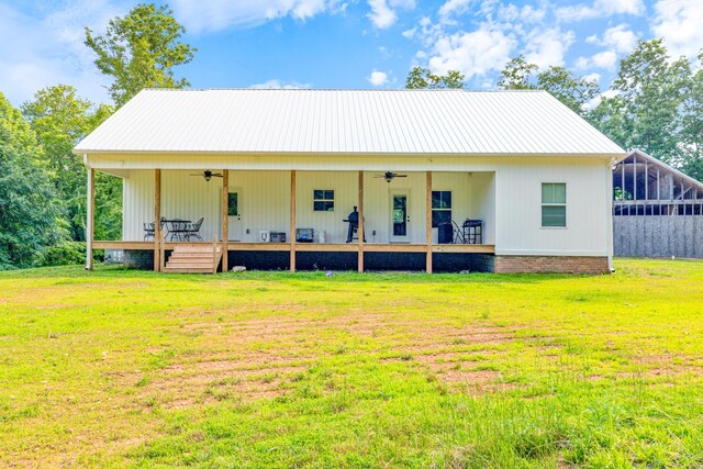 5660 Bold Springs Rd, Mc Ewen, TN 37101 - view of front of home with ceiling fan, a front yard, and metal roof