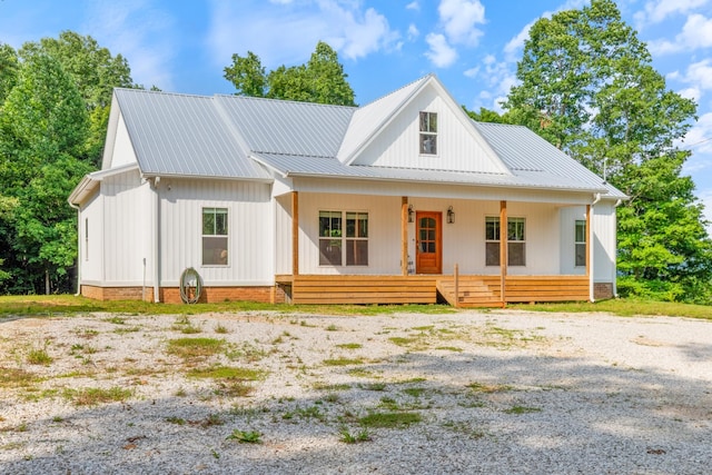 5660 Bold Springs Rd, Mc Ewen, TN 37101 - modern farmhouse featuring a porch and metal roof