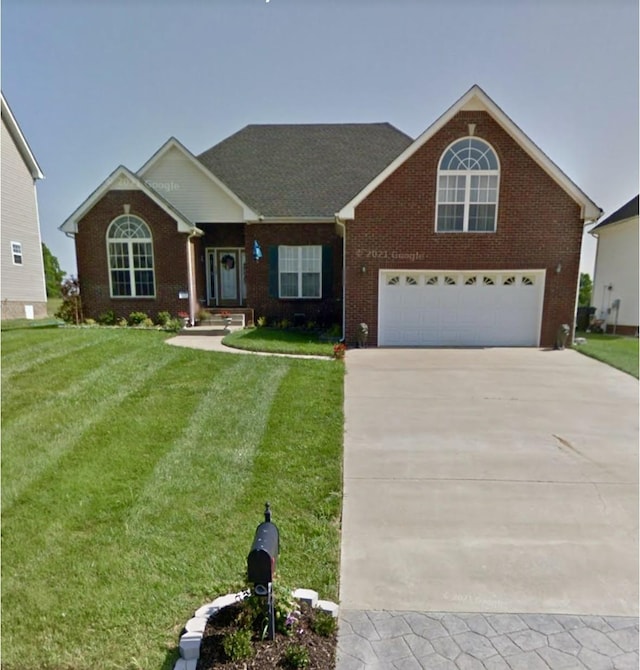 1177 Castlewood Dr, Clarksville, TN 37042 - traditional-style house with brick siding, concrete driveway, a front yard, and a garage