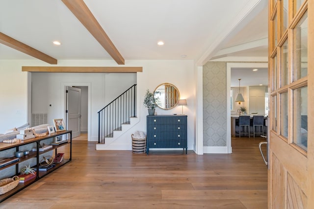 6115 Hillsboro Pike, Nashville, TN 37215 - foyer entrance featuring wallpapered walls, beam ceiling, stairway, baseboards, and wood finished floors