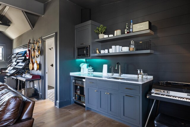 6115 Hillsboro Pike, Nashville, TN 37215 - bar featuring a sink, stainless steel microwave, wine cooler, wood finished floors, and wood walls