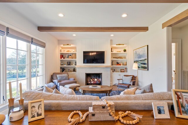6115 Hillsboro Pike, Nashville, TN 37215 - living area with beam ceiling, a premium fireplace, wood finished floors, and recessed lighting