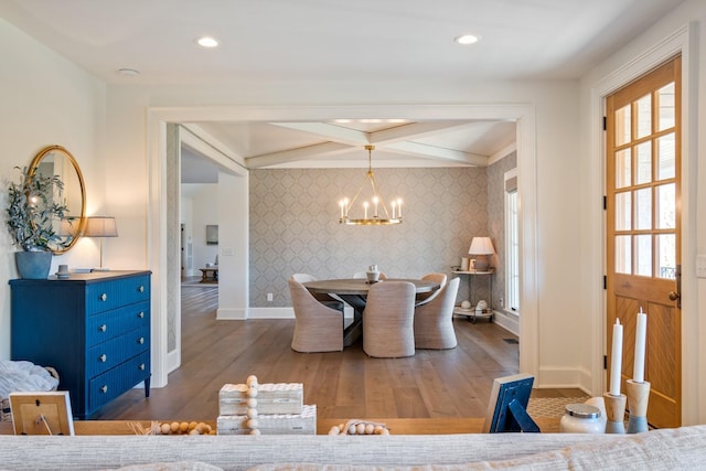 6115 Hillsboro Pike, Nashville, TN 37215 - dining space with wallpapered walls, an accent wall, baseboards, a chandelier, and wood finished floors