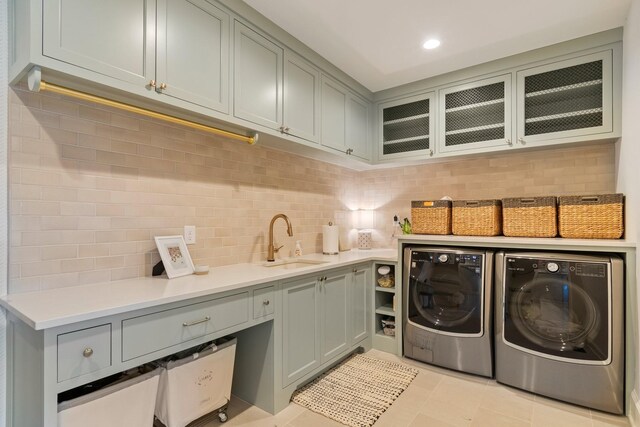 6115 Hillsboro Pike, Nashville, TN 37215 - laundry area featuring washing machine and dryer, cabinet space, and light tile patterned floors