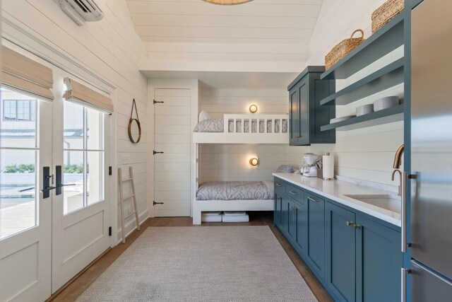 6115 Hillsboro Pike, Nashville, TN 37215 - mudroom with a sink, a wall unit AC, french doors, and wood walls