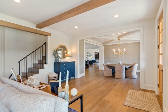 6115 Hillsboro Pike, Nashville, TN 37215 - living room featuring baseboards, wallpapered walls, beamed ceiling, stairs, and wood finished floors